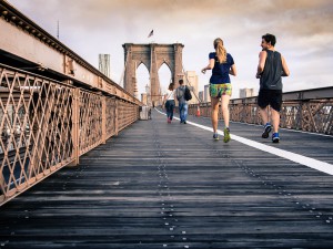 Runners-running-over-bridge